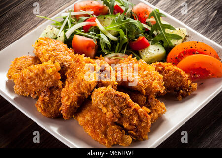 Fried chicken nuggets and vegetables Stock Photo