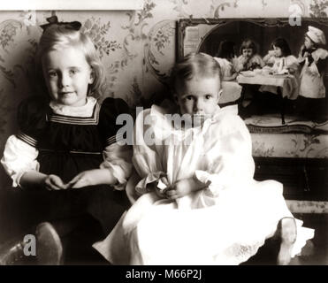 1890s 1900s TURN OF THE 20TH CENTURY PORTRAIT TWO ANONYMOUS YOUNG GIRLS SISTERS TODDLERS SITTING TOGETHER LOOKING AT CAMERA - o3781 HAR001 HARS PLEASED JOY LIFESTYLE FEMALES PORTRAITS HOME LIFE COPY SPACE PEOPLE CHILDREN HALF-LENGTH 1900s INDOORS SIBLINGS SISTERS NOSTALGIA TOGETHERNESS EYE CONTACT 1-2 YEARS 3-4 YEARS YOUNGSTER CHEERFUL TURN OF THE 20TH CENTURY TURN OF THE CENTURY 1890s SIBLING SMILES CONNECTION JOYFUL COOPERATION ANONYMOUS JUVENILES B&W BABY GIRL BLACK AND WHITE CAUCASIAN ETHNICITY HORIZONTAL INNOCENT LOOKING AT CAMERA OLD FASHIONED Stock Photo