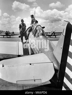 1940s 2 ARMY PILOTS STANDING FUSELAGE OF SLIDING COCKPIT SINGLE ENGINE AIRPLANE WING US ARMY AIR CORPS RANDOLPH FIELD TEXAS USA - q74718 CPC001 HARS TWO PEOPLE BATTLE GULF LIFESTYLE HISTORY CONFLICT WW2 TRANSPORT UNITED STATES COPY SPACE FRIENDSHIP FULL-LENGTH HALF-LENGTH INSPIRATION II FORCE TRANSPORTATION NOSTALGIA NORTH AMERICA TOGETHERNESS 20-25 YEARS HISTORIC NORTH AMERICAN ARMED SINGLE OBJECT WING OCCUPATION PILOTS ADVENTURE VICTORY COURAGE EXCITEMENT POWERFUL SLIDING WORLD WARS WORLD WAR WORLD WAR TWO WORLD WAR II SOUTHERN COCKPIT MOBILITY WORLD WAR 2 ARMED FORCE GULF COAST CONFLICTING Stock Photo