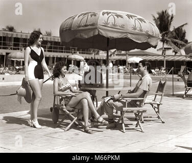 1930s 1940s 3 WOMEN BATHING SUITS SINGLE MAN CASUAL CLOTHES SITTING TALKING UNDER POOL SIDE UMBRELLA MIAMI BEACH FLORIDA USA - s1625 HAR001 HARS STYLE TROPICAL BATHING SUITS VACATION CAUCASIAN LIFESTYLE SWIM GROWNUP HEALTHINESS LUXURY UNITED STATES COPY SPACE FRIENDSHIP FULL-LENGTH HALF-LENGTH GROWN-UP UNITED STATES OF AMERICA NOSTALGIA SHADE NORTH AMERICA TOGETHERNESS 20-25 YEARS 25-30 YEARS 30-35 YEARS 35-40 YEARS NORTH AMERICAN TIME OFF HAPPINESS URBAN CENTER SWIMMING POOL LEISURE STYLES RELAXATION AND GETAWAY RECREATION WATER SOUTHEAST TRIO HOLIDAYS SOUTHERN FASHIONS EAST COAST VACATIONS Stock Photo