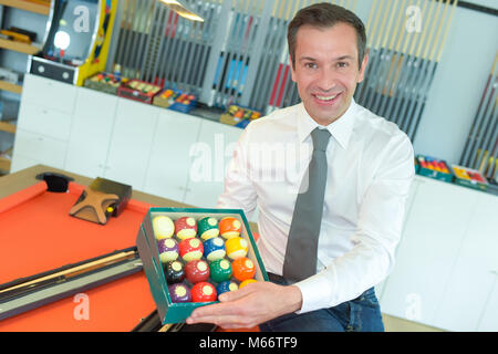 professional billiard player showing billiard balls Stock Photo
