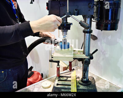 Master works on drilling milling machine Stock Photo