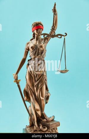 Justitia Bronze Statue with Libra and Sword and Blindfold for Justice Stock Photo