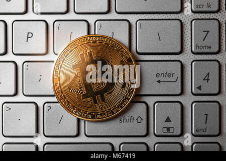 bitcoin on computer keyboard. top view Stock Photo