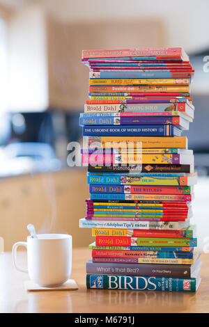 Kidderminster, UK. 1st March, 2018. Taking time out of the day with a steaming hot cup of coffee to read a few classic novels on World book day. A day which celebrates authors, illustrators and books, but most importantly a day that celebrates reading. Credit: Lee Hudson/Alamy Live News Stock Photo
