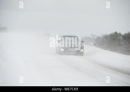 Aberdeenshire. 1st Mar, 2018. UK Weather: Traffic on the A947 negotiating near white out in heavy snow near Oldmeldrum, Aberdeenshire Scotland. Credit: Paul Glendell/Alamy Live News Stock Photo