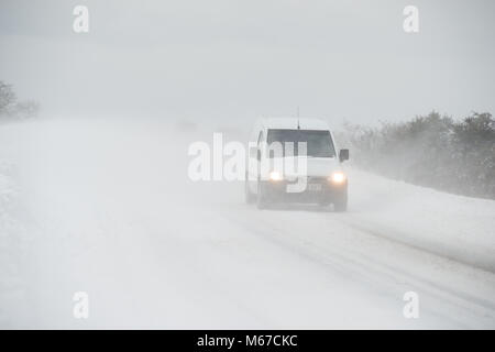 Aberdeenshire. 1st Mar, 2018. UK Weather: Traffic on the A947 negotiating near white out in heavy snow near Oldmeldrum, Aberdeenshire Scotland. Credit: Paul Glendell/Alamy Live News Stock Photo