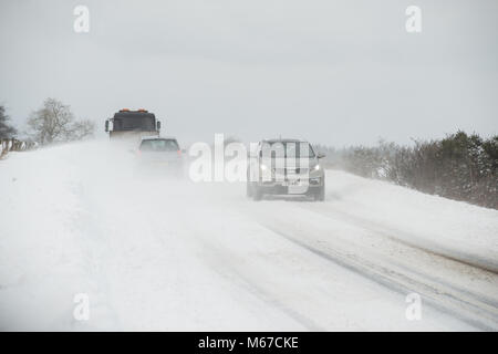 Aberdeenshire. 1st Mar, 2018. UK Weather: Traffic on the A947 negotiating near white out in heavy snow near Oldmeldrum, Aberdeenshire Scotland. Credit: Paul Glendell/Alamy Live News Stock Photo