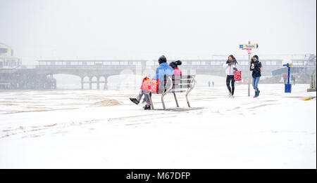 Bournemouth; UK; 1 March 2018. Enjoying the unusual sight of snow on the beach at Bournemouth as the so called 'Beast from the East' arrives on the south coast. Credit John Beasley/Alamy Live News Stock Photo