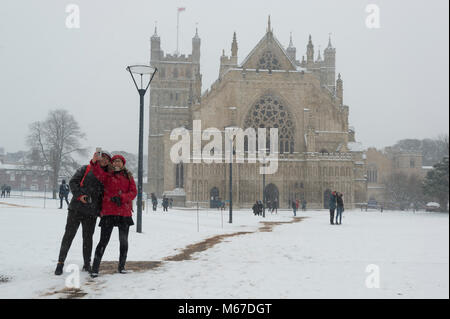 Exeter, Devon, UK. 1st March2018. The Beast from the East meets Storm Emma in Exeter as a red weather warning is issued. People enjoy the snow outside Exeter Cathedral. Credit: Theo Moye/Alamy Live News Stock Photo