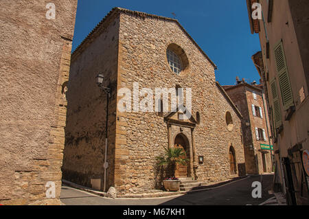 Stone made facade of ancient church in Chateaudouble, a quiet village with medieval origin. Located in the Provence region, southeastern France. Stock Photo