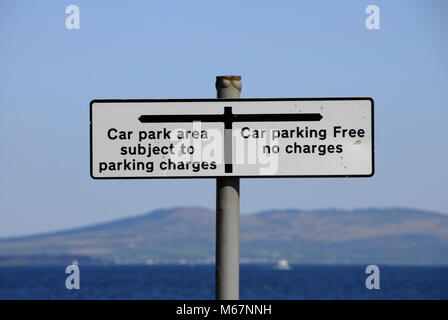 Sign in car park showing free parking and charged parking in different areas,  Dunoon Stock Photo