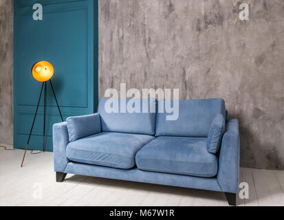 Living room interior with blue sofa and retro lamp Stock Photo