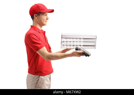 Teenage delivery boy holding pizza boxes and a payment terminal isolated on white background Stock Photo