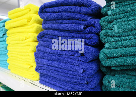 Stacks of Colorful Towels on Sale Stock Photo