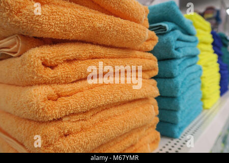 Stacks of Colorful Towels on Sale Stock Photo