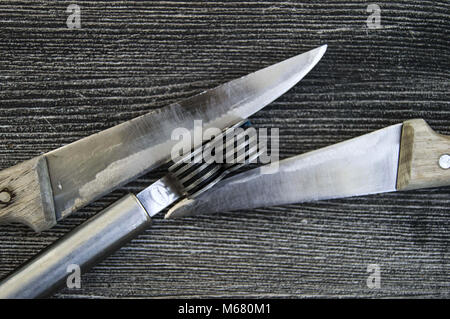 Knives stands next to the blade grinding tools, knife sharpening tool, blunt blades, sharpening with sharpening tools, grinding, Stock Photo