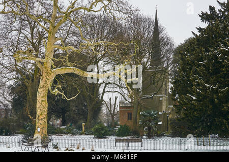 St Mary's Old Church from Clissold Park, Stoke Newington, London UK in winter, with snow on the ground Stock Photo