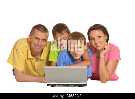 Parents with sons using laptop Stock Photo