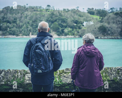 Two people resting and admiring the view from the Pyg Track towards ...