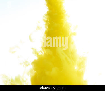 Yellow ink water swirl isolated on white background. Abstract paint background Stock Photo
