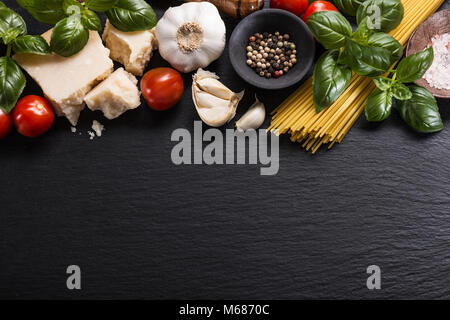 Top view of different vegetables and products for pasta making on rough table. Stock Photo