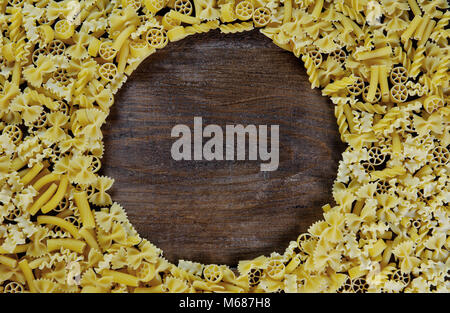 Pasta background - mix of dried italian pasta on wood Stock Photo