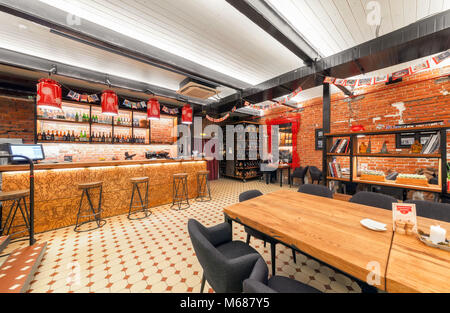 Interior of the Russian farm restaurant 'LAVKALAVKA'. Wooden bar counter Stock Photo