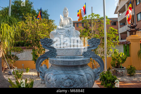 Outdoor statue of Avalokiteshvara Boddhisattva in afternoon sun at Huyen Quang Temple. Bankstown. AUSTRALIA Stock Photo