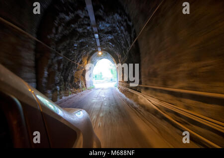 View of the tunnel exit from the car Stock Photo