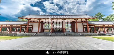 Nara - August 25, 2017: Yakushi-Ji temple. Panoramic view of Chumon gate from Kondo (Main hall), listed as UNESCO World Heritage Site as Historic Monu Stock Photo