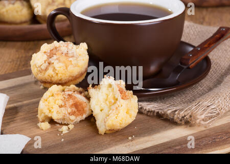 Closeup of cinnamon cream cheese coffee cakeand cup of coffee on a wooden tray Stock Photo