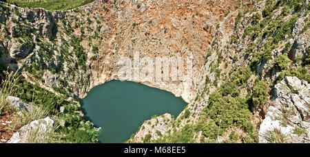 panorama of the red lake near the city of imotski, croatia Stock Photo