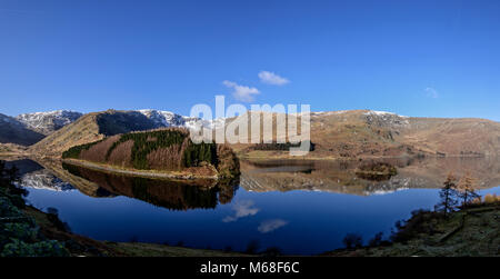 Panoramic view across Haweswater towards High Street and Kidsty Pike with stunning mirror-like eflections Stock Photo