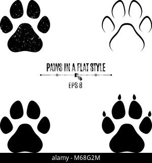 A set of dog's paws. Black traces in different styles. Isolated on white background. Silhouettes of paws. Vector illustration Stock Vector