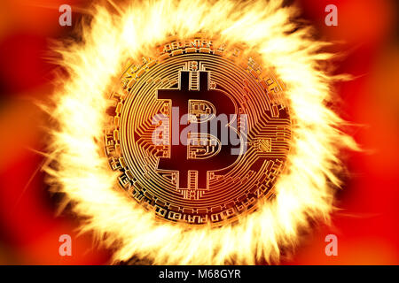 Bitcoin cryptocurrency golden coin on fire Stock Photo