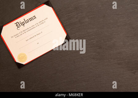Symbols Representing Graduation on a Chalkboard Stock Photo