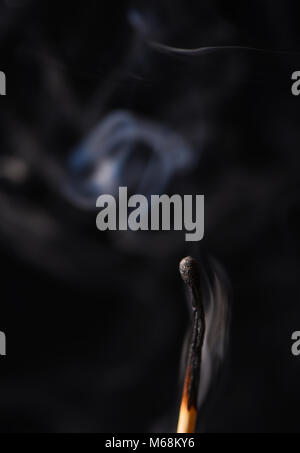 Smoke from an extinct wooden match Stock Photo