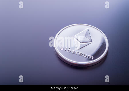 Ethereum (ETH) cryptocurrency real coin. Stock Photo