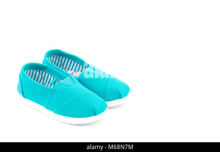 Pair of Teal Children's Shoes on a White Background Stock Photo
