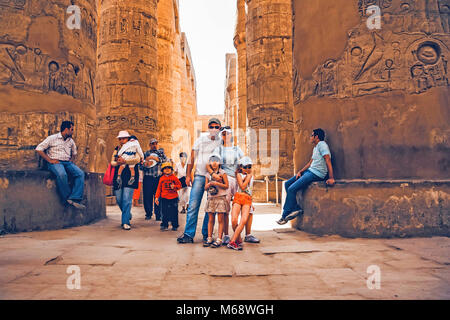 LUXOR, EGYPT - FEBRUARY 17, 2010: Happy tourists at the Karnak temple of Luxor Stock Photo