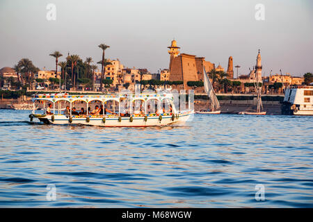 LUXOR, EGYPT - FEBRUARY 17, 2010: Tourist boat on Nile by Luxor city Stock Photo