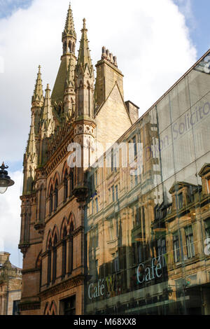 Reflections in the glass frontage of the Wool Exchange building, now the home of Waterstones, in Bradford, West Yorkshire Stock Photo