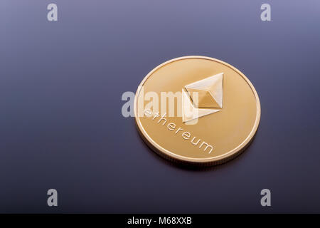 Ethereum (ETH) cryptocurrency real coin. Stock Photo