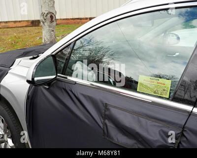 Prototype Hyundai SUV automobile or car disguised in a black vinyl  camouflaged wrap parked in a parking lot in Auburn Alabama, USA. Stock Photo