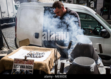 Roasted chestnuts for sale on the streets of Lisbon, Portugal. Stock Photo