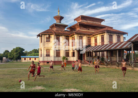 Hsipaw, Myanmar - October 7, 2016: Unidentified burmese buddhist monks plays soccer near the monastery in Hsipaw, Burma Stock Photo