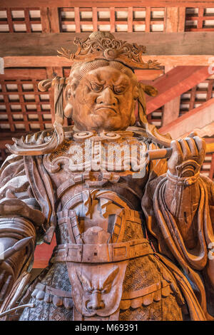 Wooden statue of Komokuten guardian (Deva king) One of Celestial Guardians of Four Directions at Daibutsu-den (Great Buddha Hall) in Todai-ji Temple Stock Photo