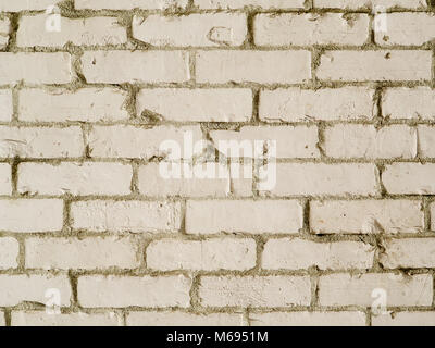 White country style brick wall background photograph. Rough textured bricks painted white in farmhouse style Stock Photo