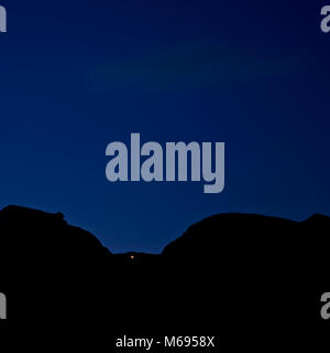Dachstein mountains at night with single point of light, Austria Stock Photo